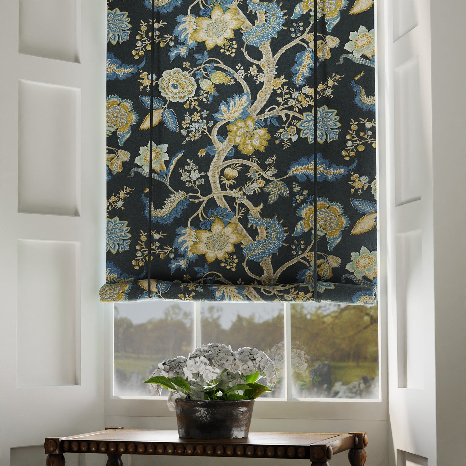 Blinds is a printed linen fabric with life of tree pattern in yellow, blue and black colours.