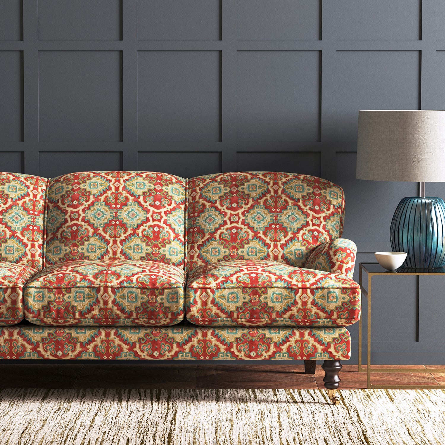 Velvet sofa upholstered in a printed velvet fabric with an oriental geometric design in multicolours