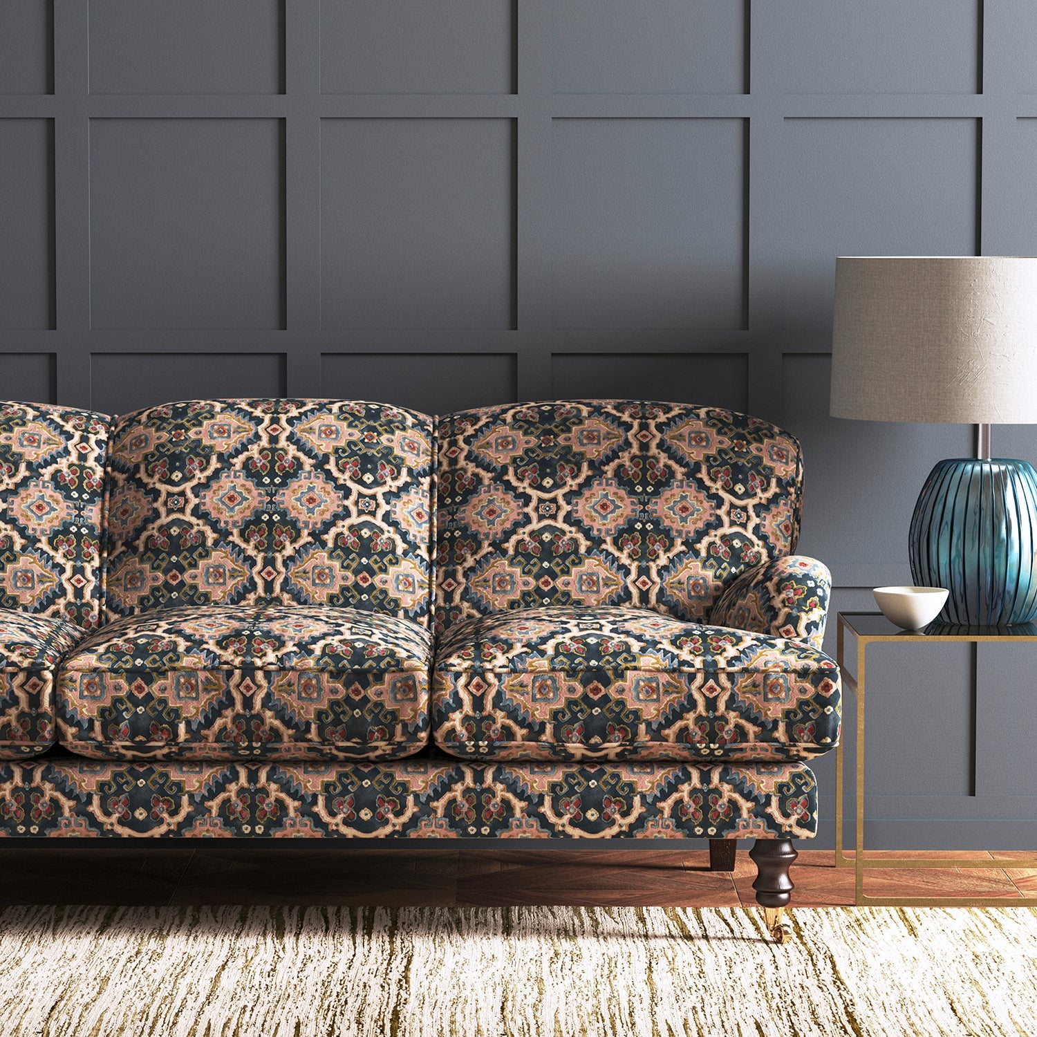 Velvet sofa upholstered in a printed velvet fabric with an oriental geometric design in multicolours