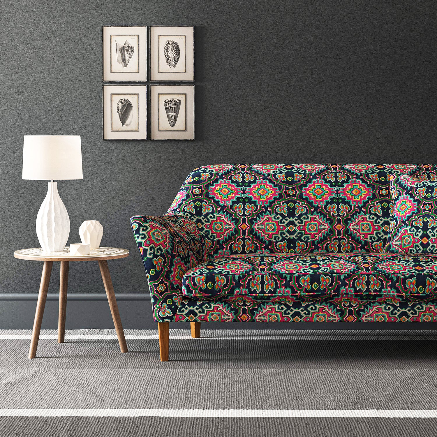 Velvet sofa upholstered in a printed velvet fabric with an oriental geometric design in vibrant colours