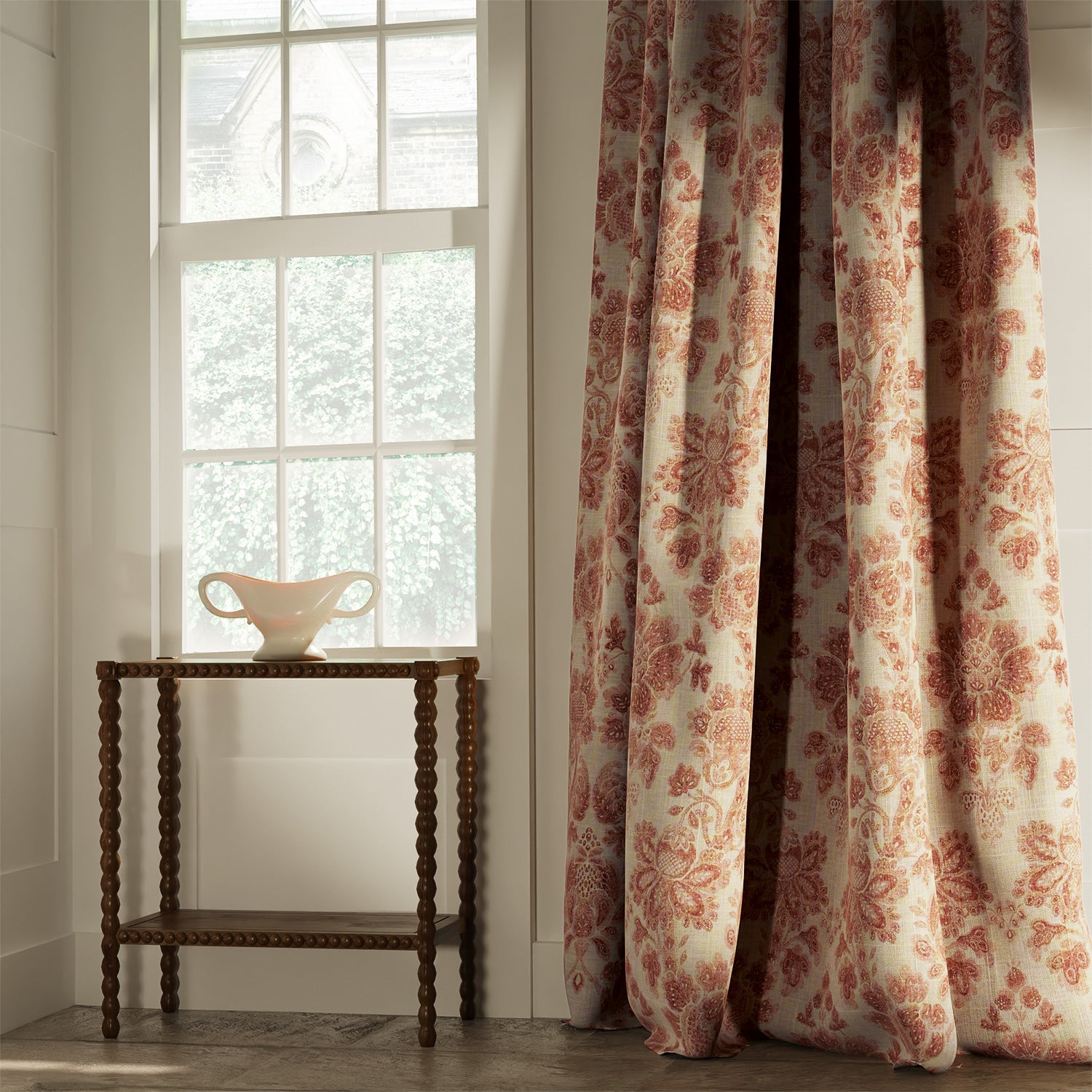 Curtains in a classic light red floral damask fabric