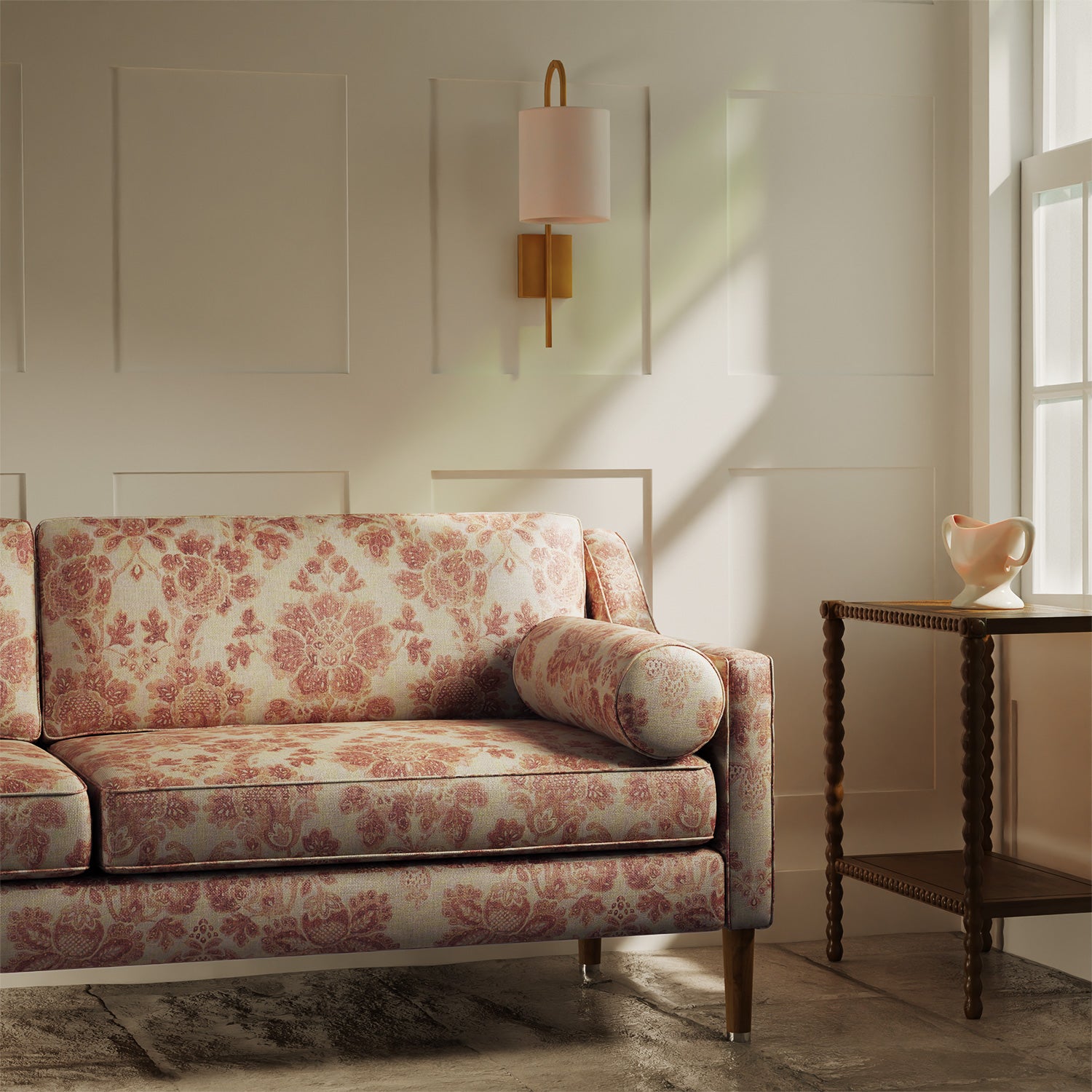 Sofa upholstered in a luxury light red floral damask fabric