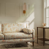 Sofa upholstered in a luxury light coloured vintage inspired floral fabric