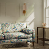 Sofa upholstered in a luxury multicoloured floral bouquet fabric