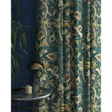 Curtains with a blue fabric with stylised floral design