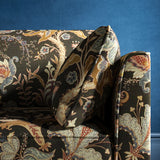 Sofa with a dark grey fabric with stylised floral design