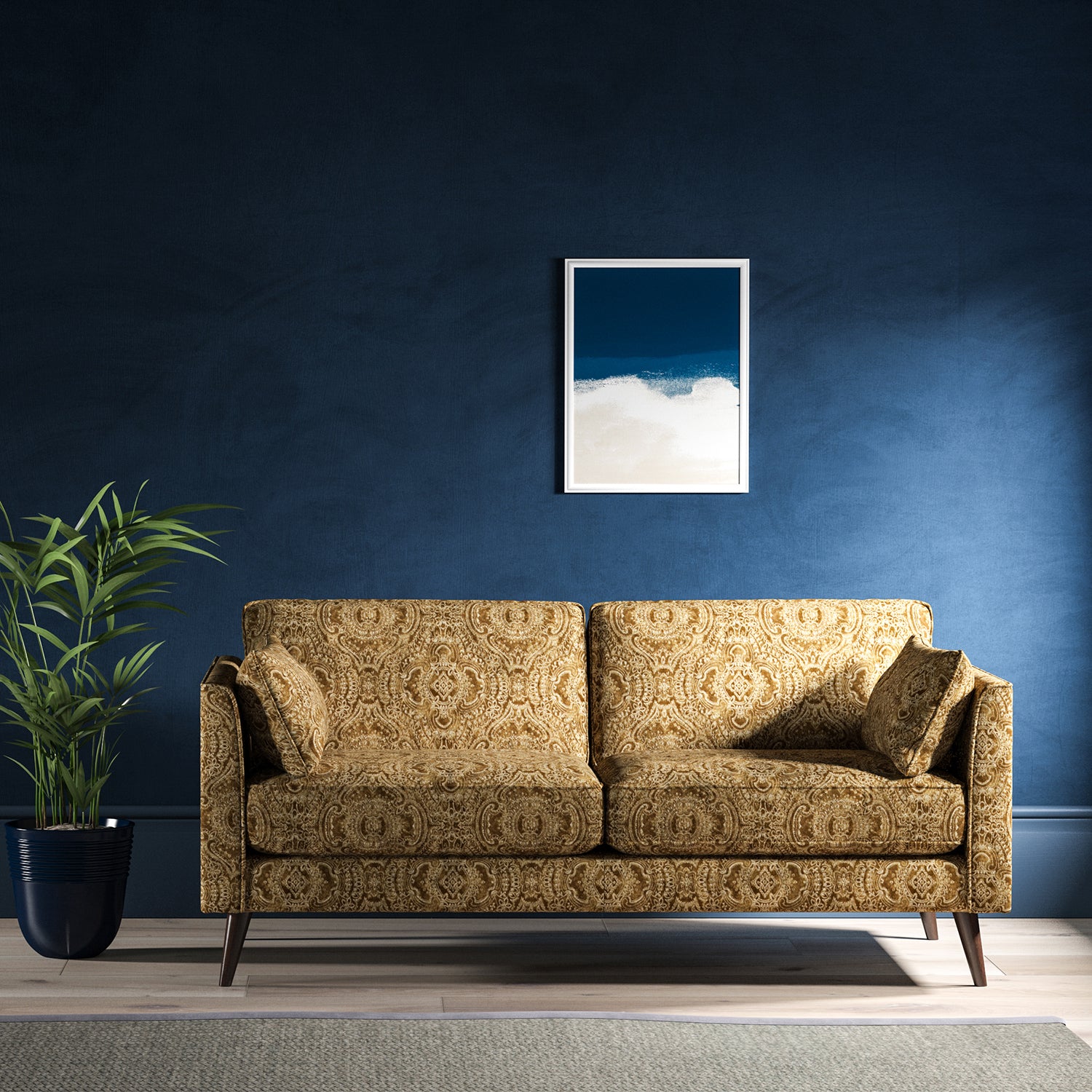 Sofa upholstered in a gold velvet upholstery fabric with intricate jewel like design