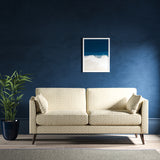 Sofa upholstered in a neutral herringbone upholstery fabric