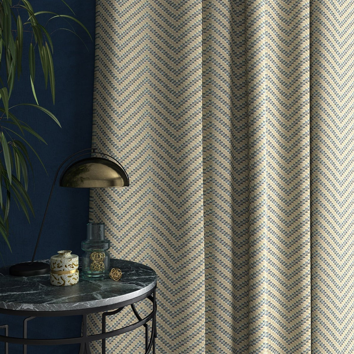 Curtain in a light blue and neutral herringbone weave fabric