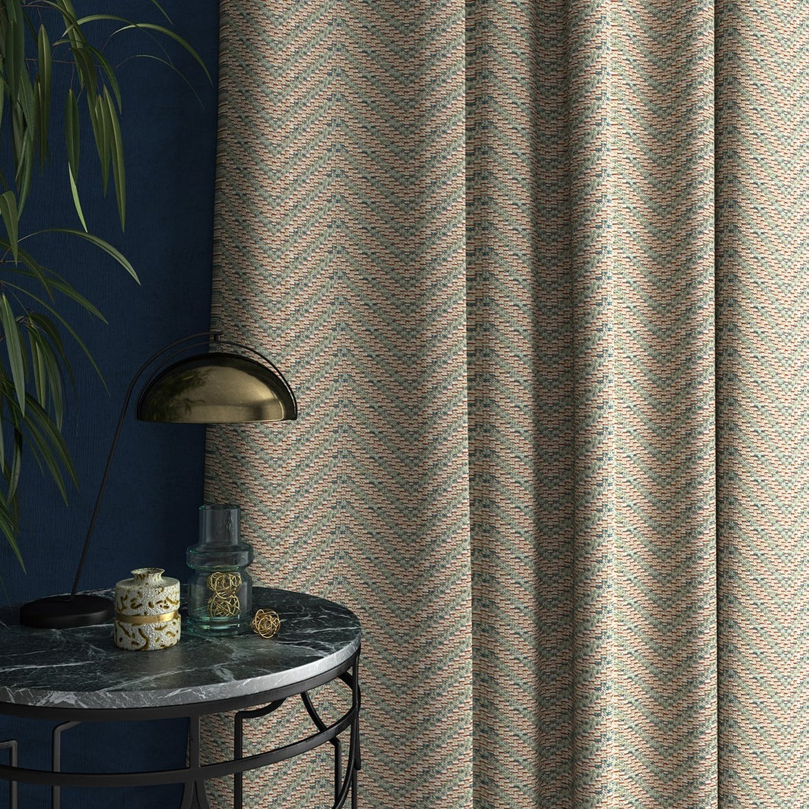 Curtain in a light blue and neutral herringbone weave fabric