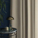 Curtain in a light blue and neutral herringbone weave fabric