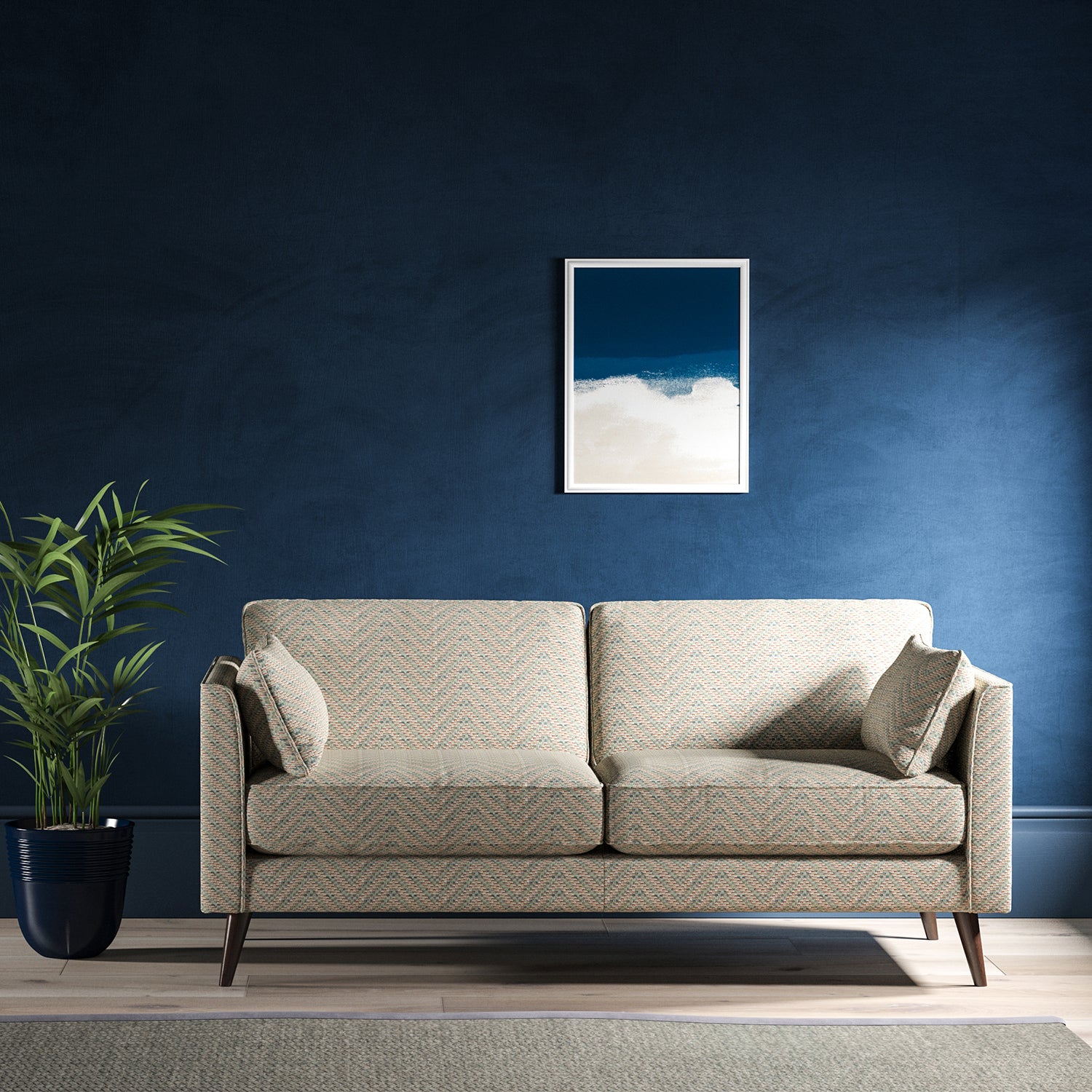 Sofa upholstered in a light blue and neutral herringbone upholstery fabric