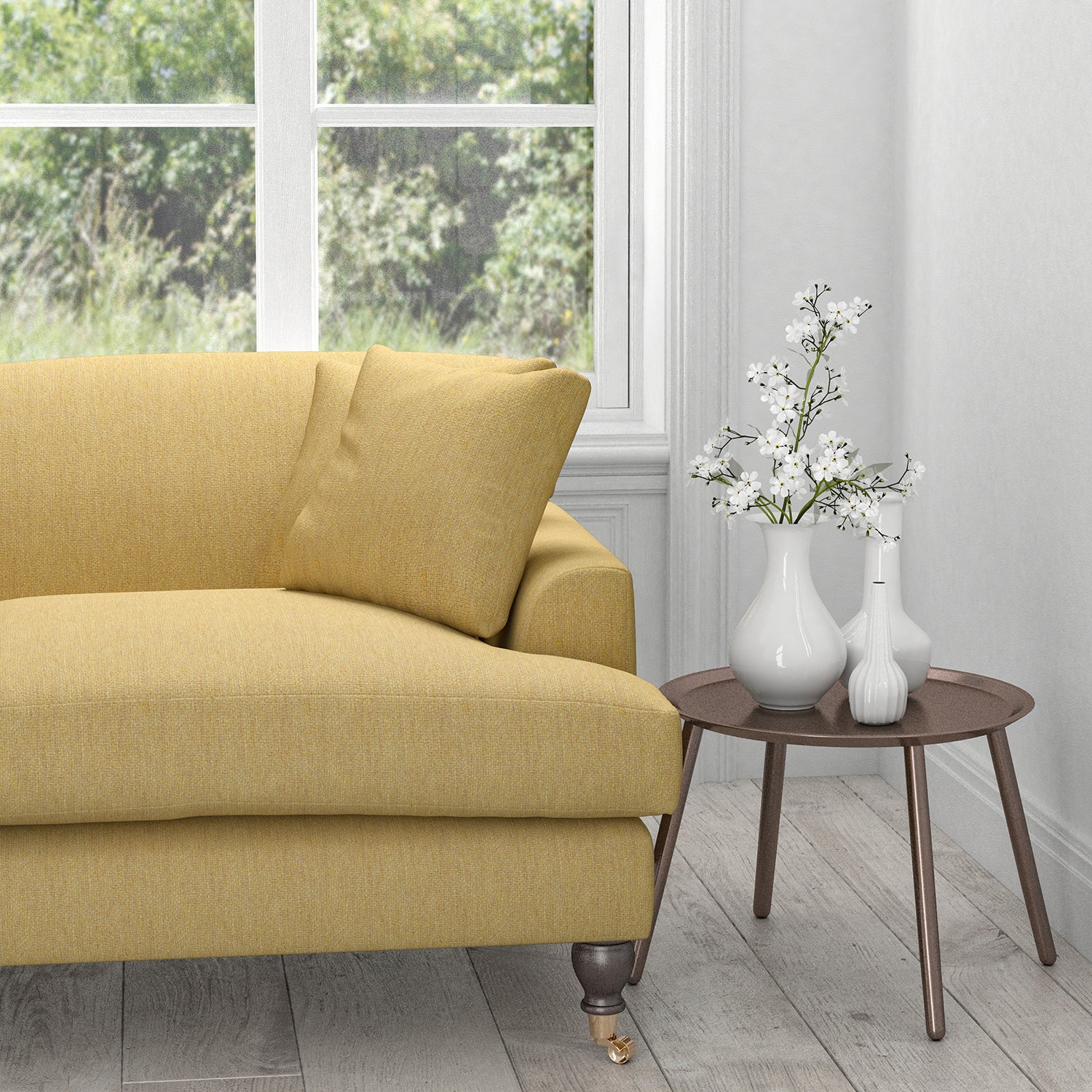 Sofa in a light yellow fabric with neutral woven geometric design