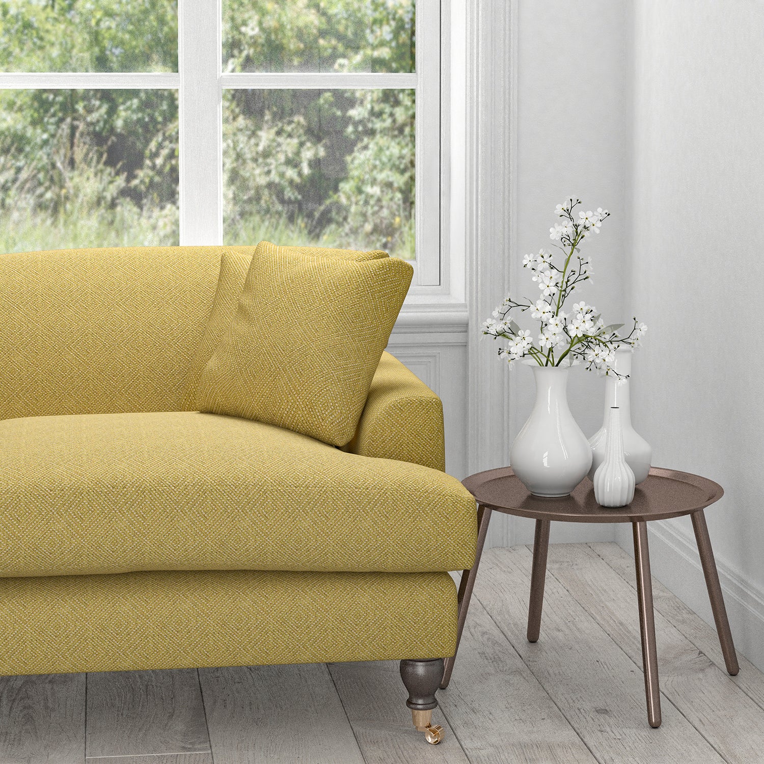 Sofa in a green yellow fabric with a light neutral woven geometric design