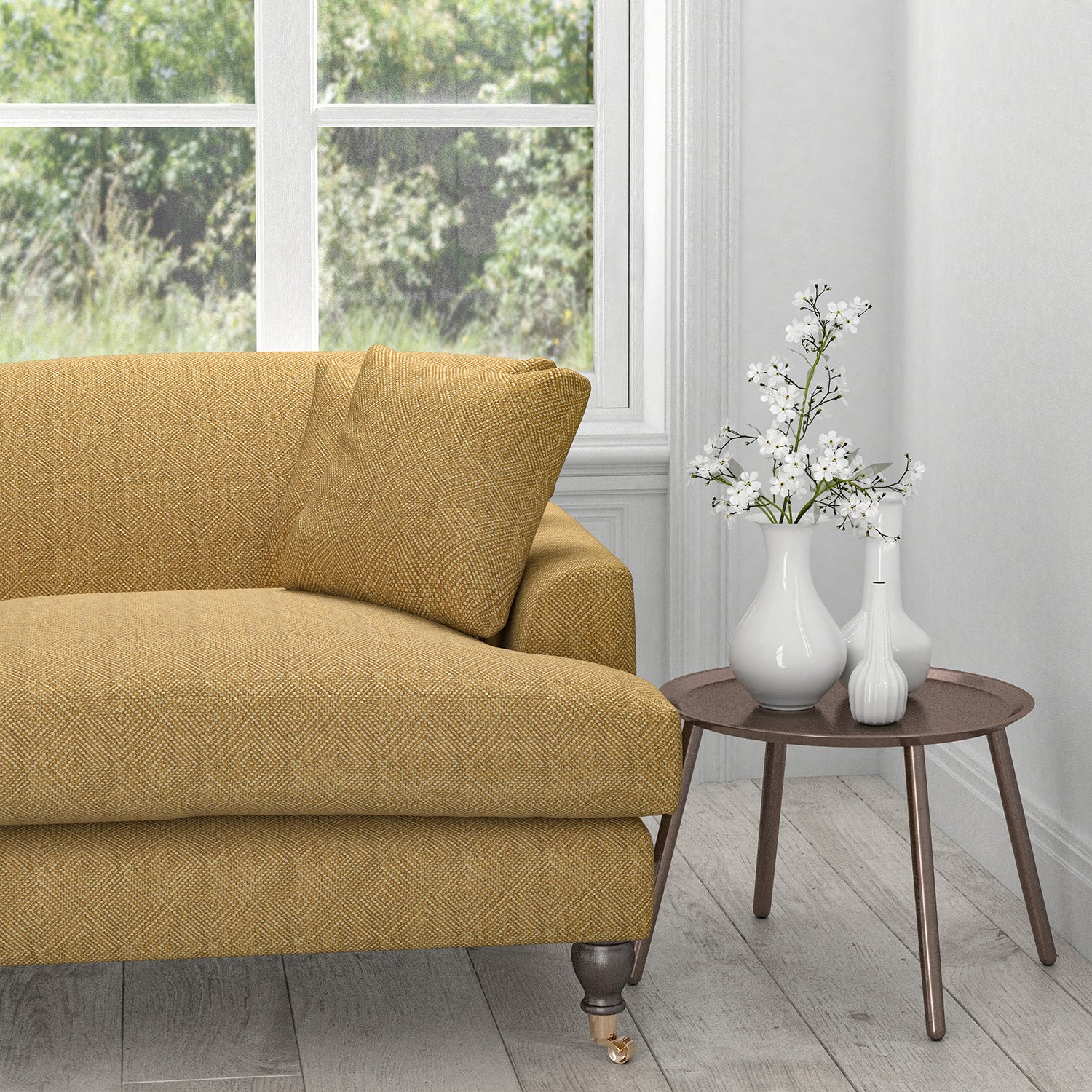 Sofa in a mustard yellow fabric with a light woven geometric design