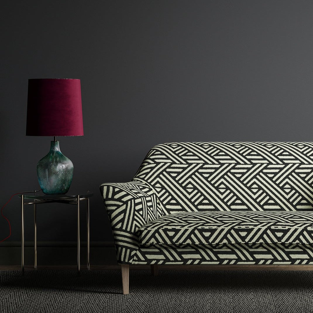 Sofa upholstered in a black and white geometric print