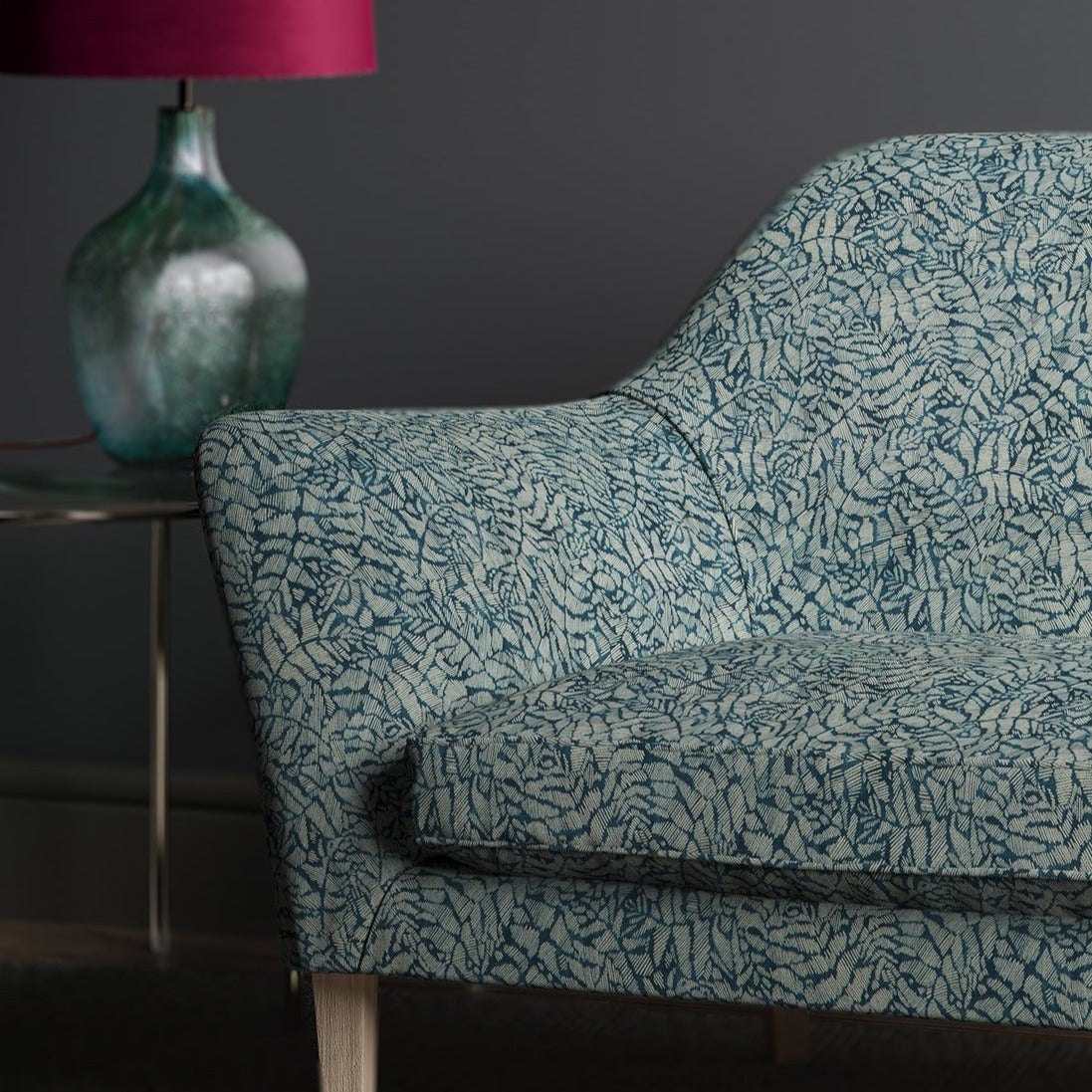 Dark blue sofa with a small white print