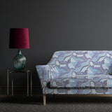 Sofa upholstered in a blue wavy printed linen fabric