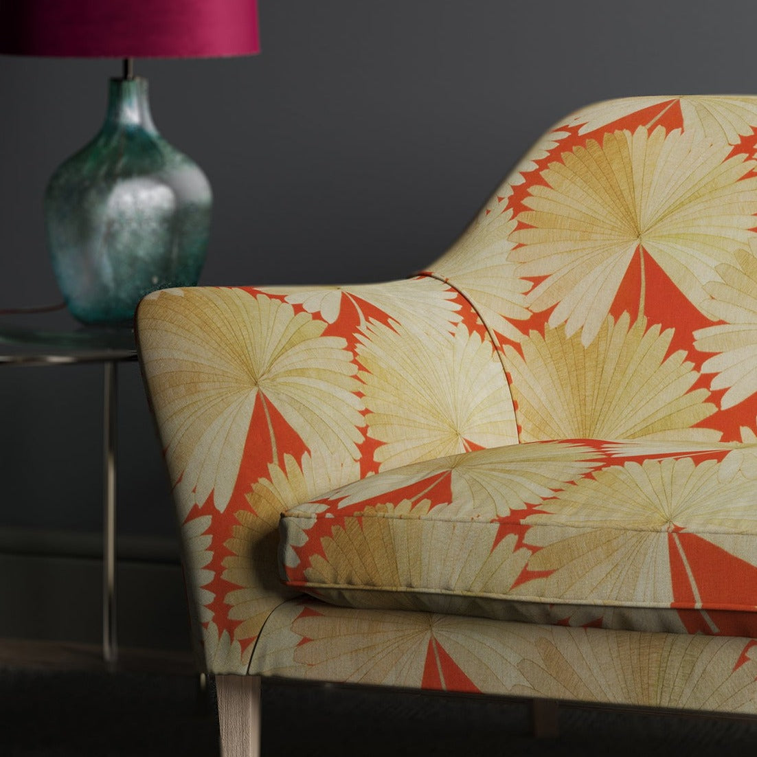 Sofa in an orange linen fabric with oriental printed fan design.
