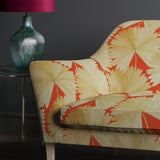 Sofa in an orange linen fabric with oriental printed fan design.