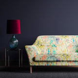Sofa in a pastel print tropical linen fabric Edit alt text
