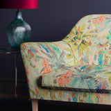 Sofa in a light linen fabric with pastel tropical print fabric