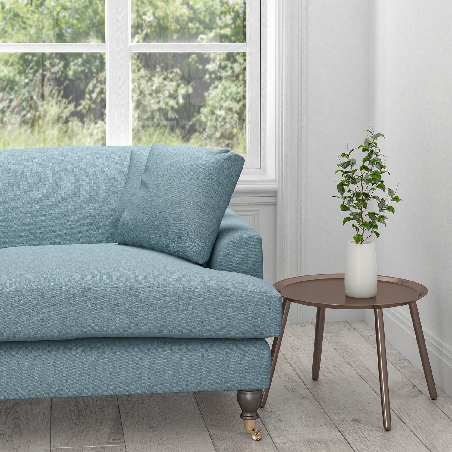 Sofa in a plain powder blue cotton upholstery fabric