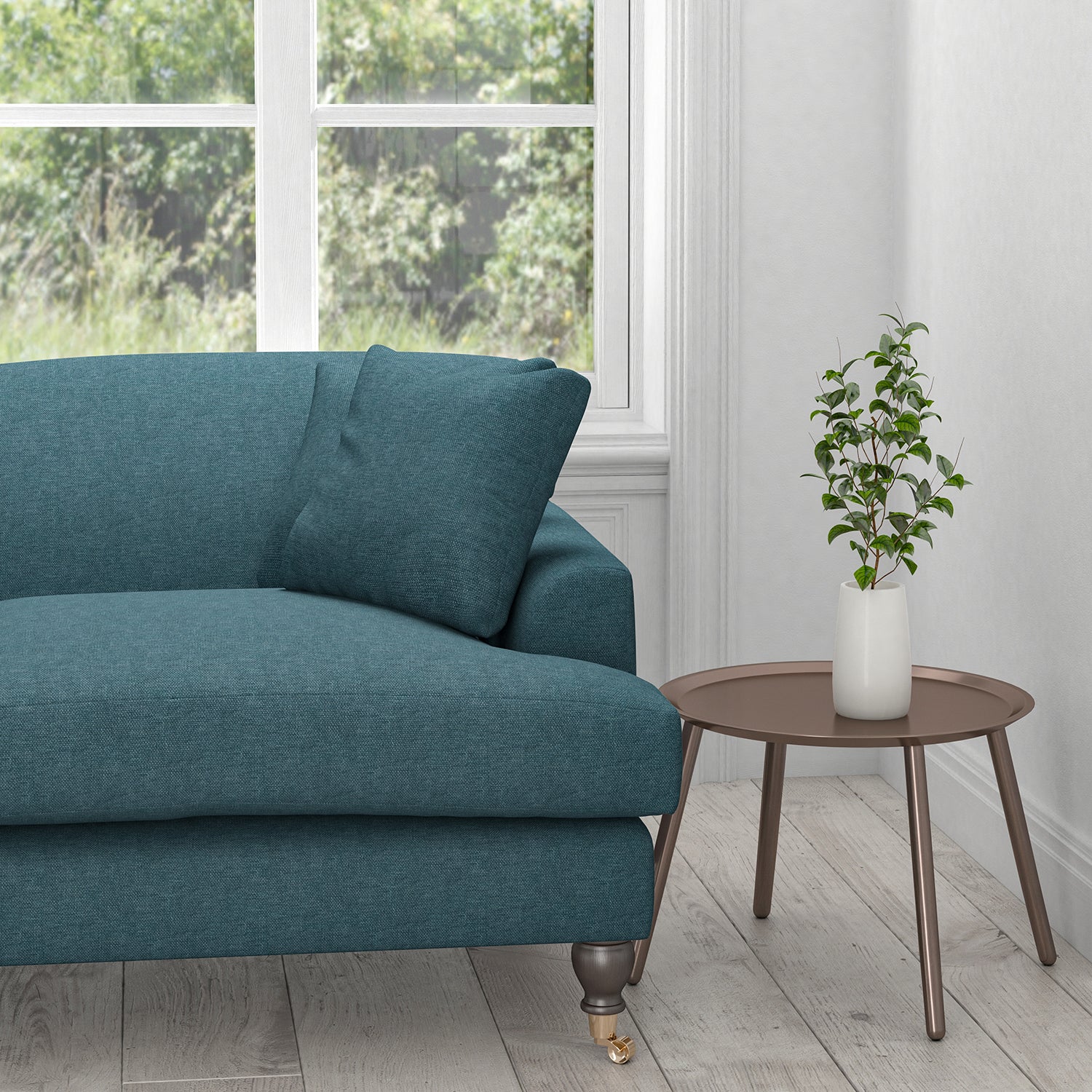 Sofa upholstered in a ocean blue plain cotton fabric