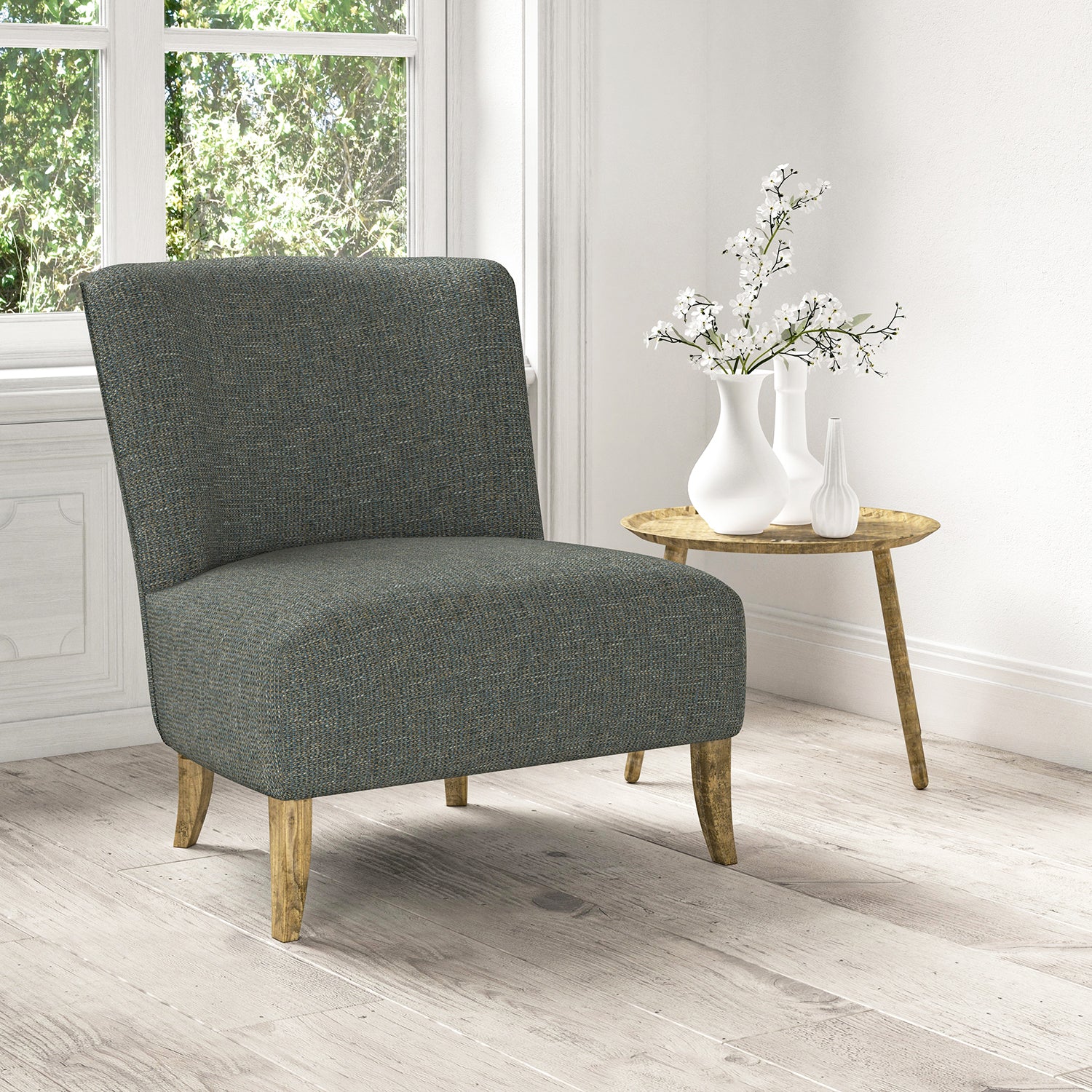 Chair upholstered in a stain resistant blue fabric with a tweed design