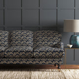 Velvet sofa in a dark blue velvet fabric with abstract animal print design