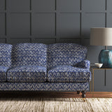 Velvet sofa in a blue velvet fabric with colour block design and stain resistant finish