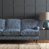 Velvet sofa in a blue velvet sofa with stain resistant finish and abstract design