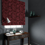Velvet blind in a dark red velvet fabric with a contemporary carpet design