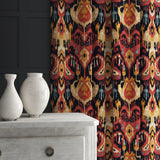 Velvet curtain in a red and orange velvet fabric with contemporary abstract design