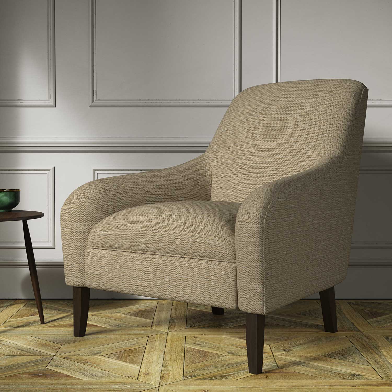 Chair covered in a woven fabric in a herringbone design in Bisque
