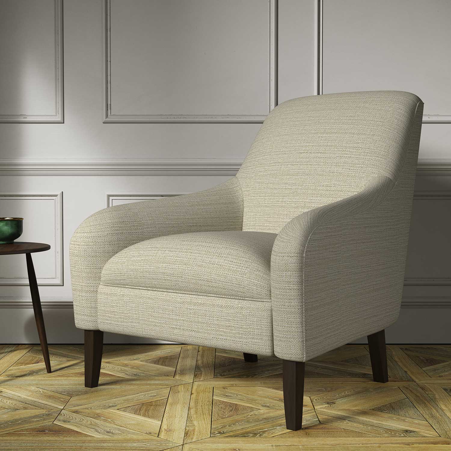 Chair covered in a woven fabric in a herringbone design in Linen