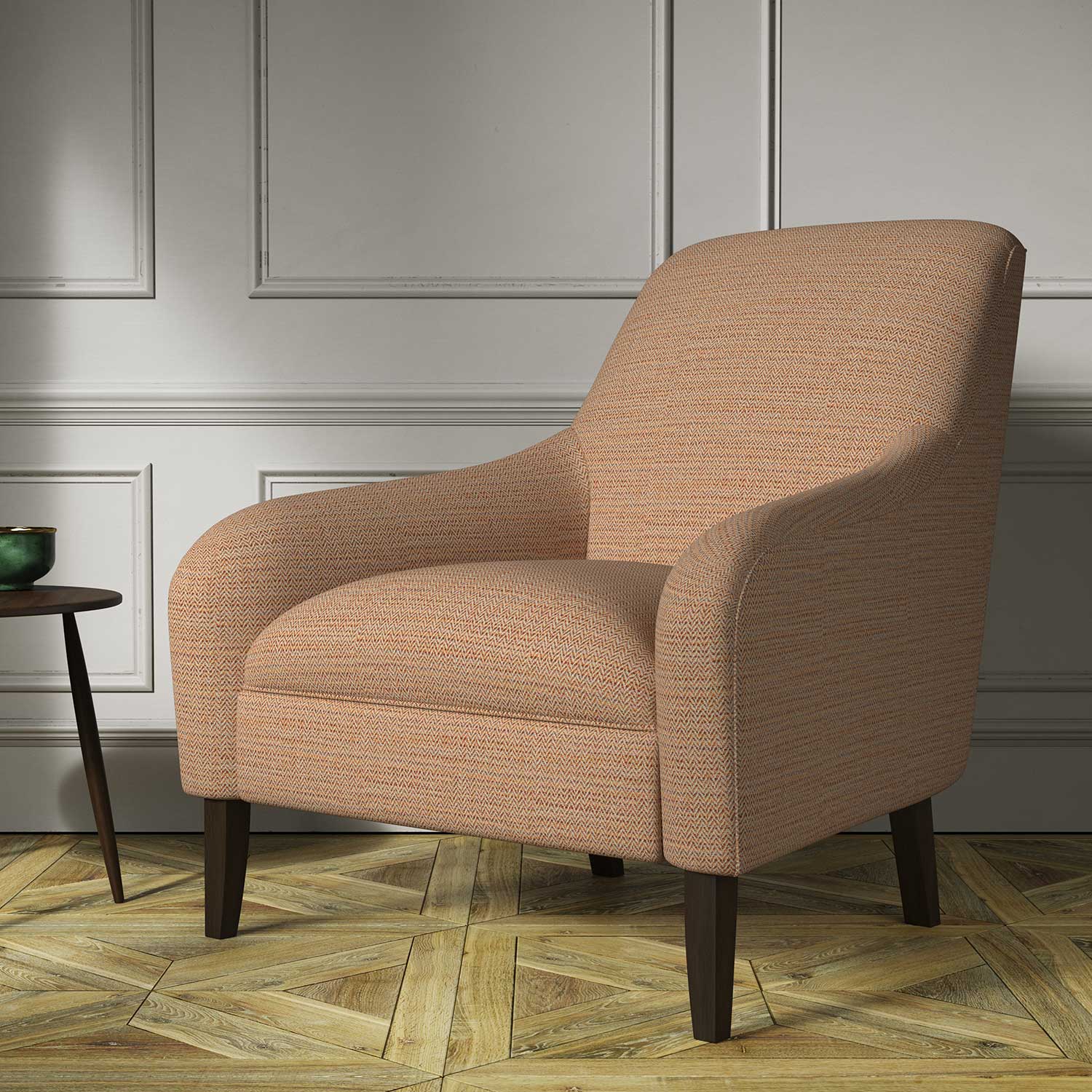 Chair covered in a woven fabric in a herringbone design in Burnt Orange