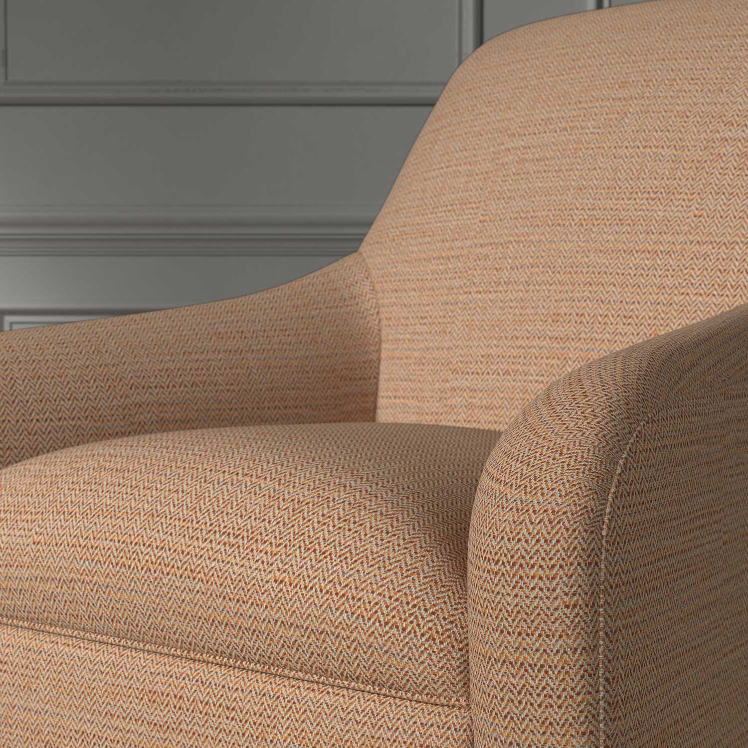 Close up of a chair covered in a woven fabric in a herringbone design in Burnt Orange