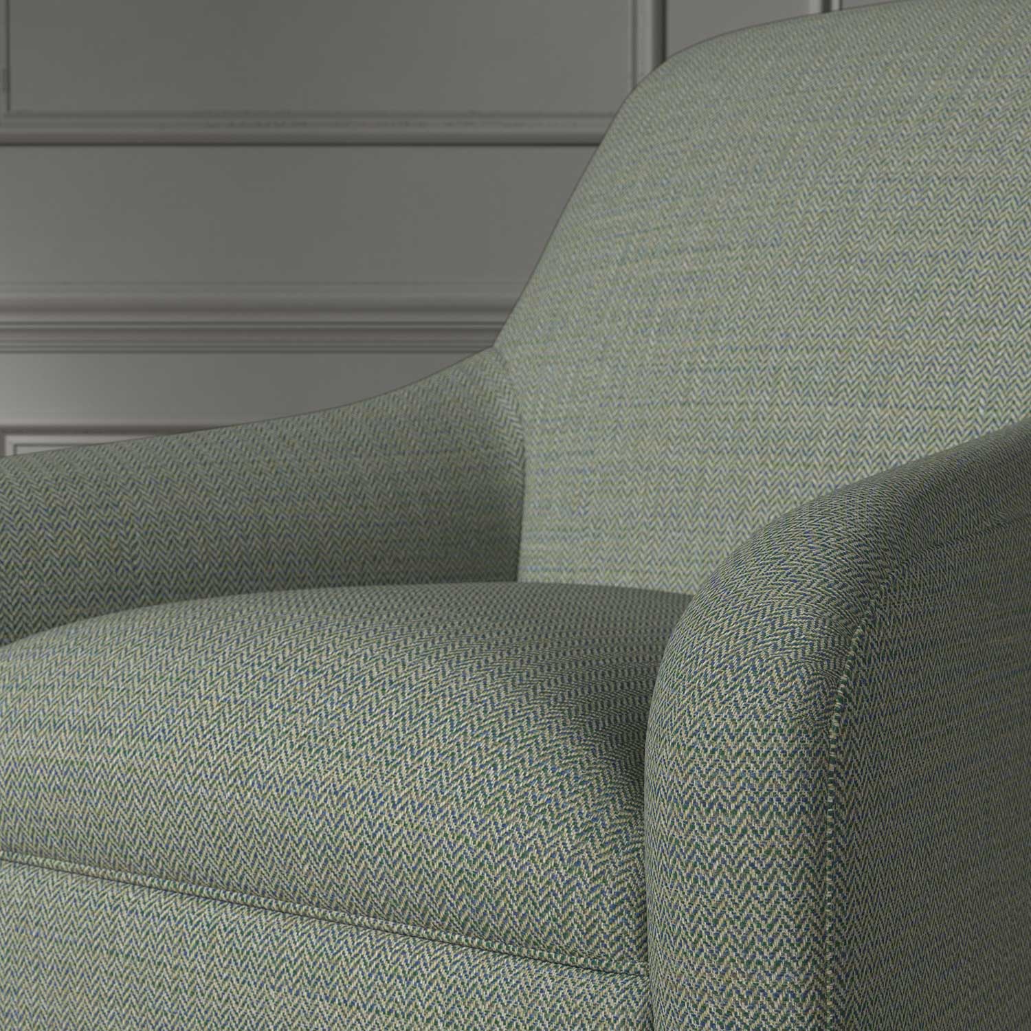 Close up of a chair covered in a woven fabric in a herringbone design in Neptune