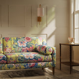 Sofa upholstered in a lively, large scale floral linen fabric