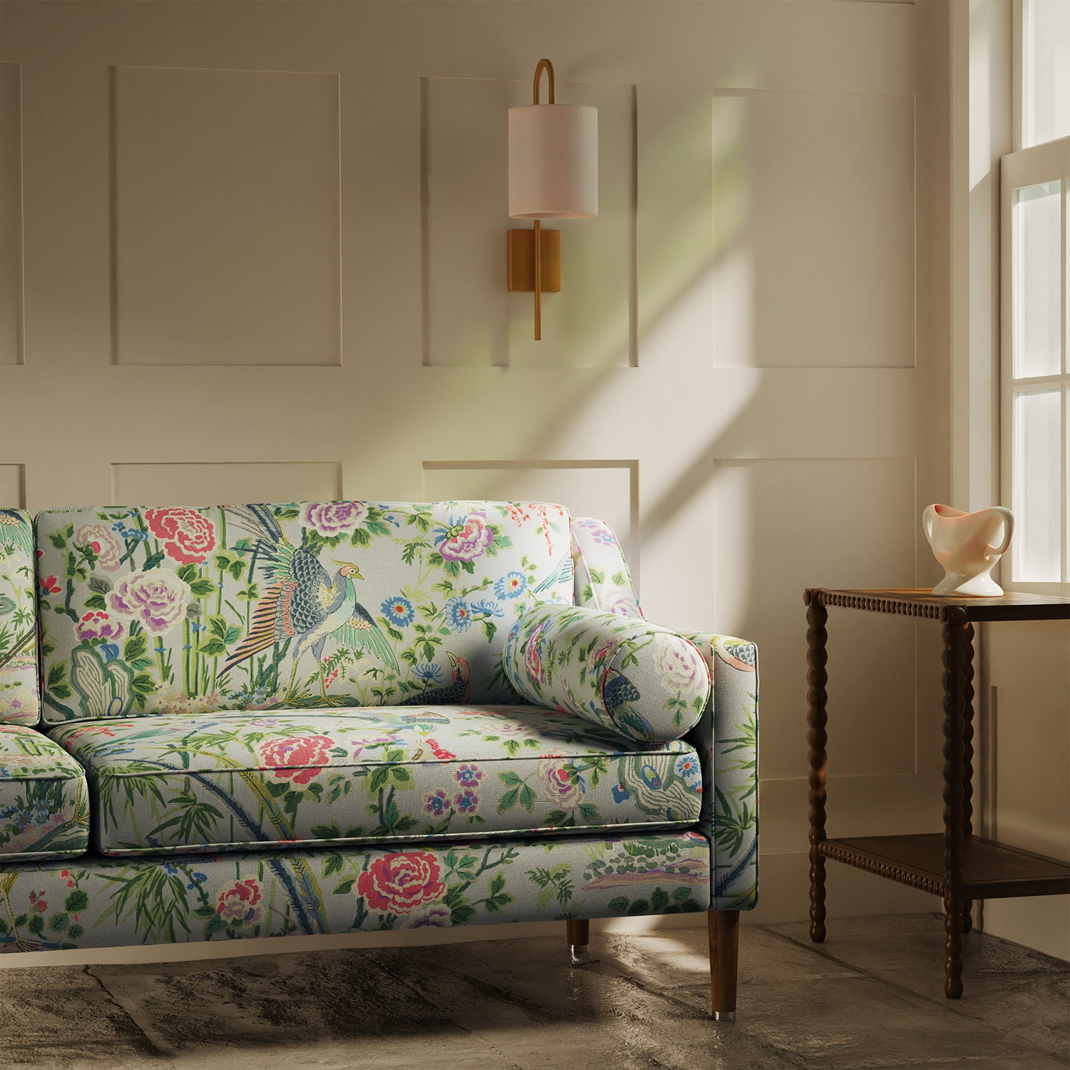 Sofa upholstered in a lively, floral and bird linen fabric