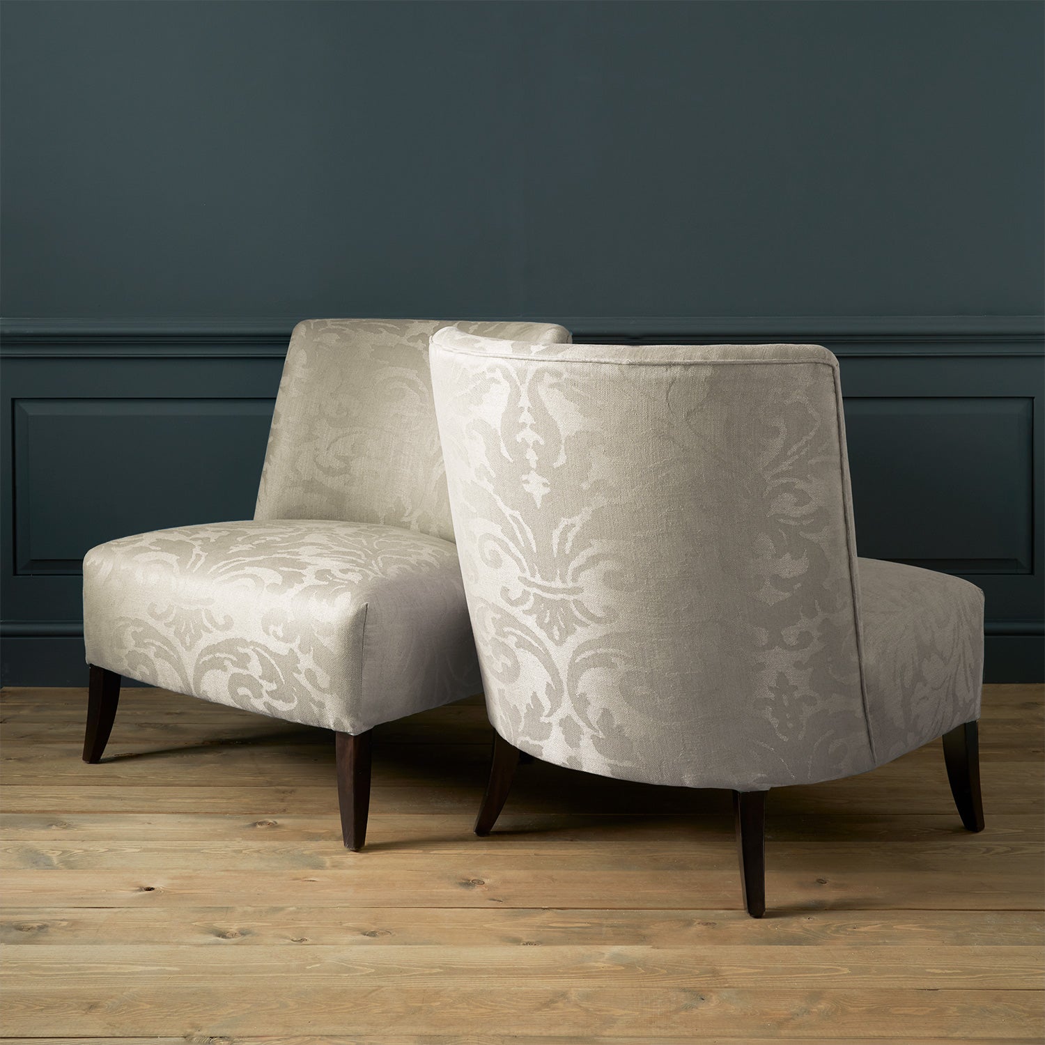 Armchairs in a contemporary damask fabric in a light neutral colour