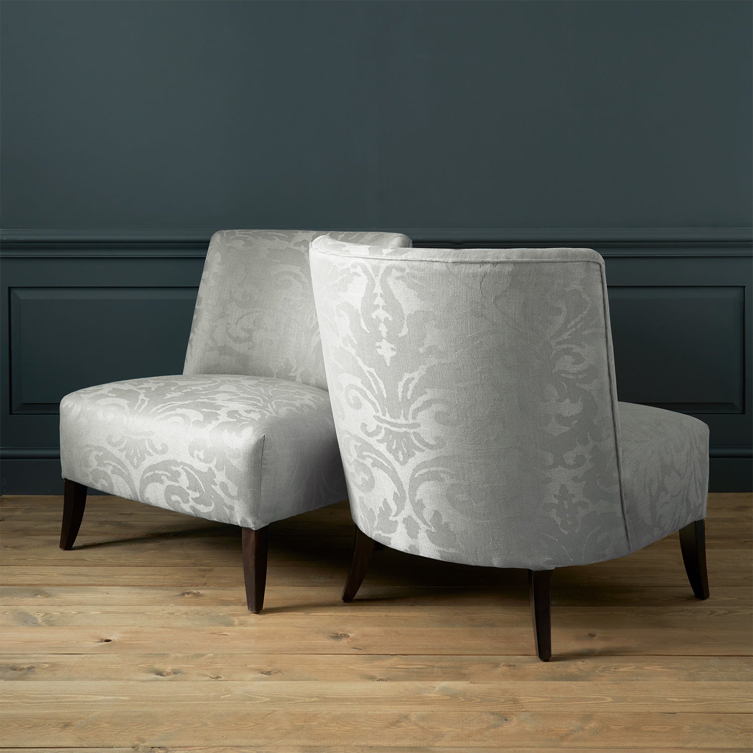 Armchairs in a a contemporary damask fabric in a cream colour.