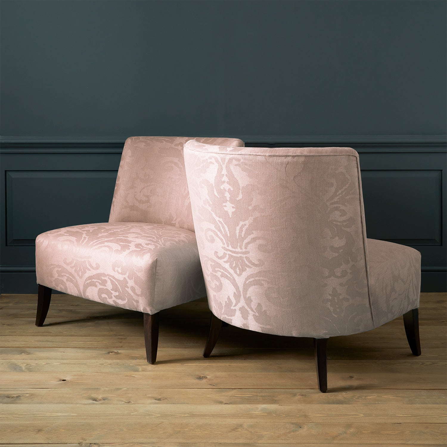 Armchairs in a a contemporary damask fabric in a dusky pink colour.