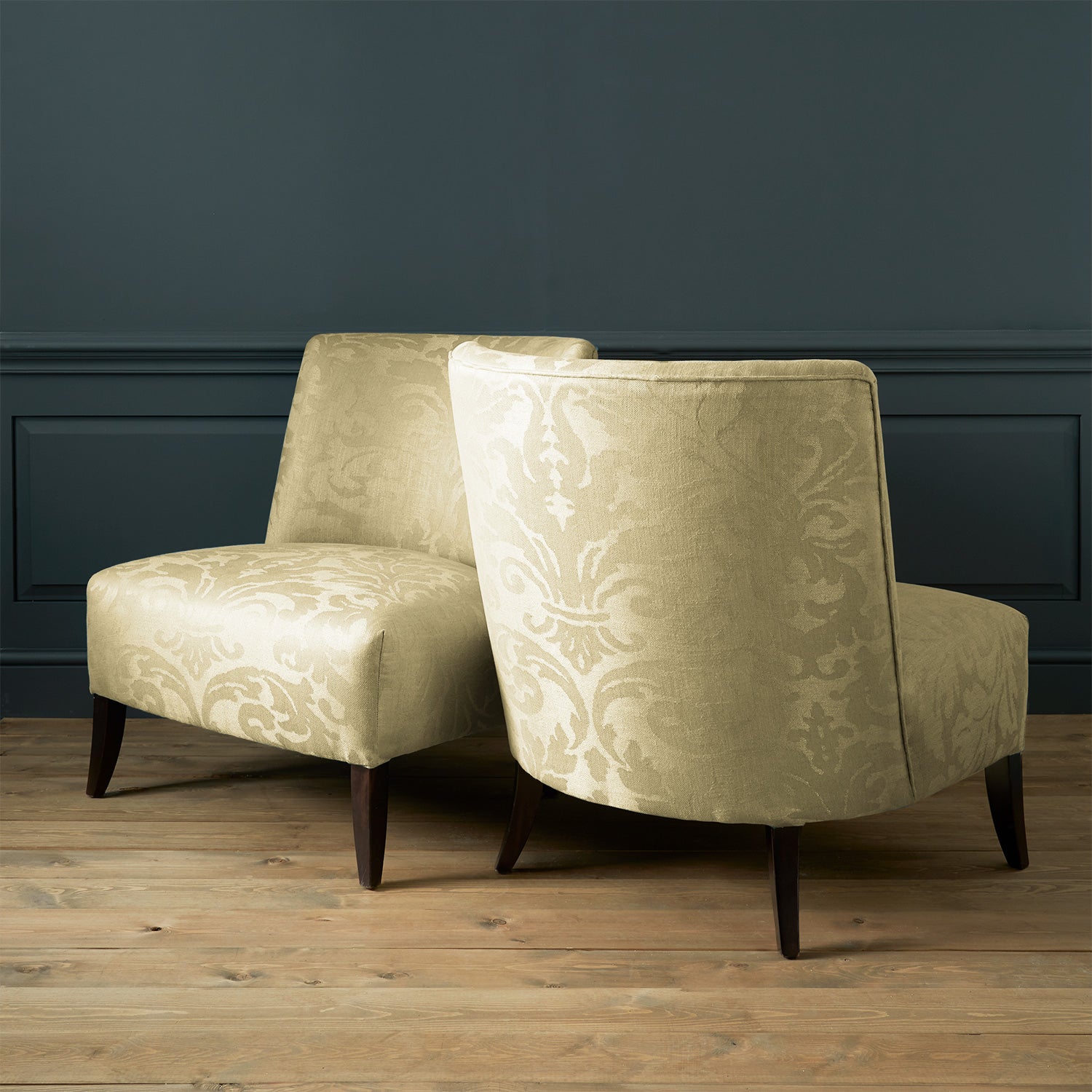 Armchairs in a contemporary damask fabric with light green colours.