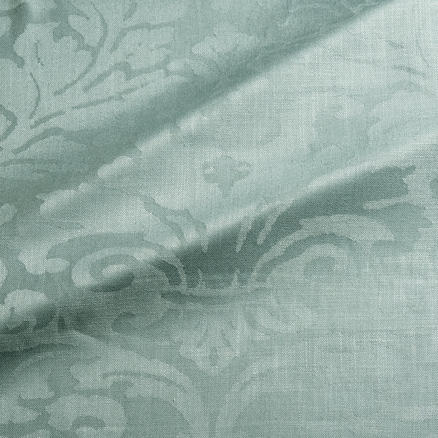 Fabric swatch of a contemporary damask fabric in a light blue colour for upholstery and curtains.
