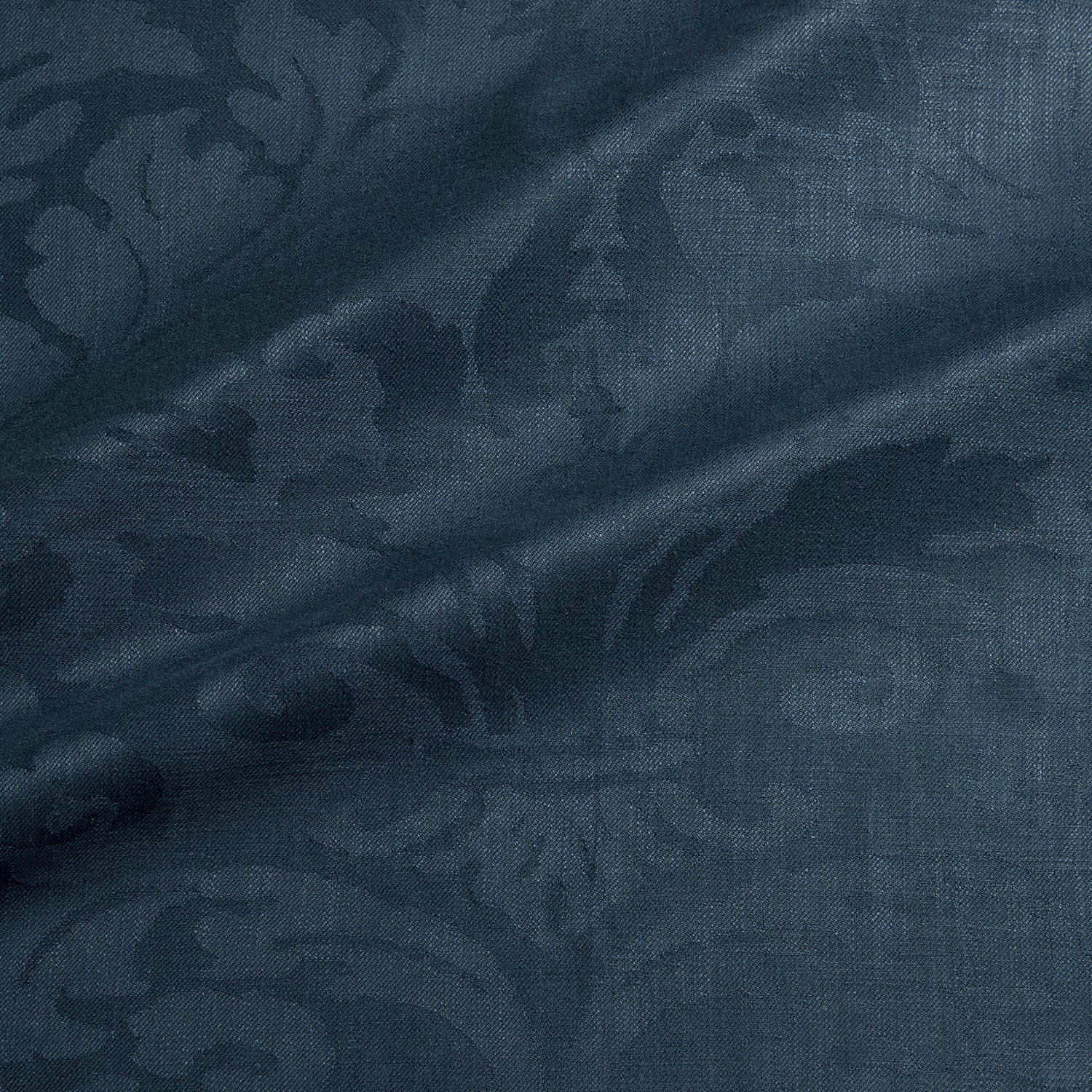 Fabric swatch of a contemporary damask fabric in a dark blue colour for upholstery and curtains.