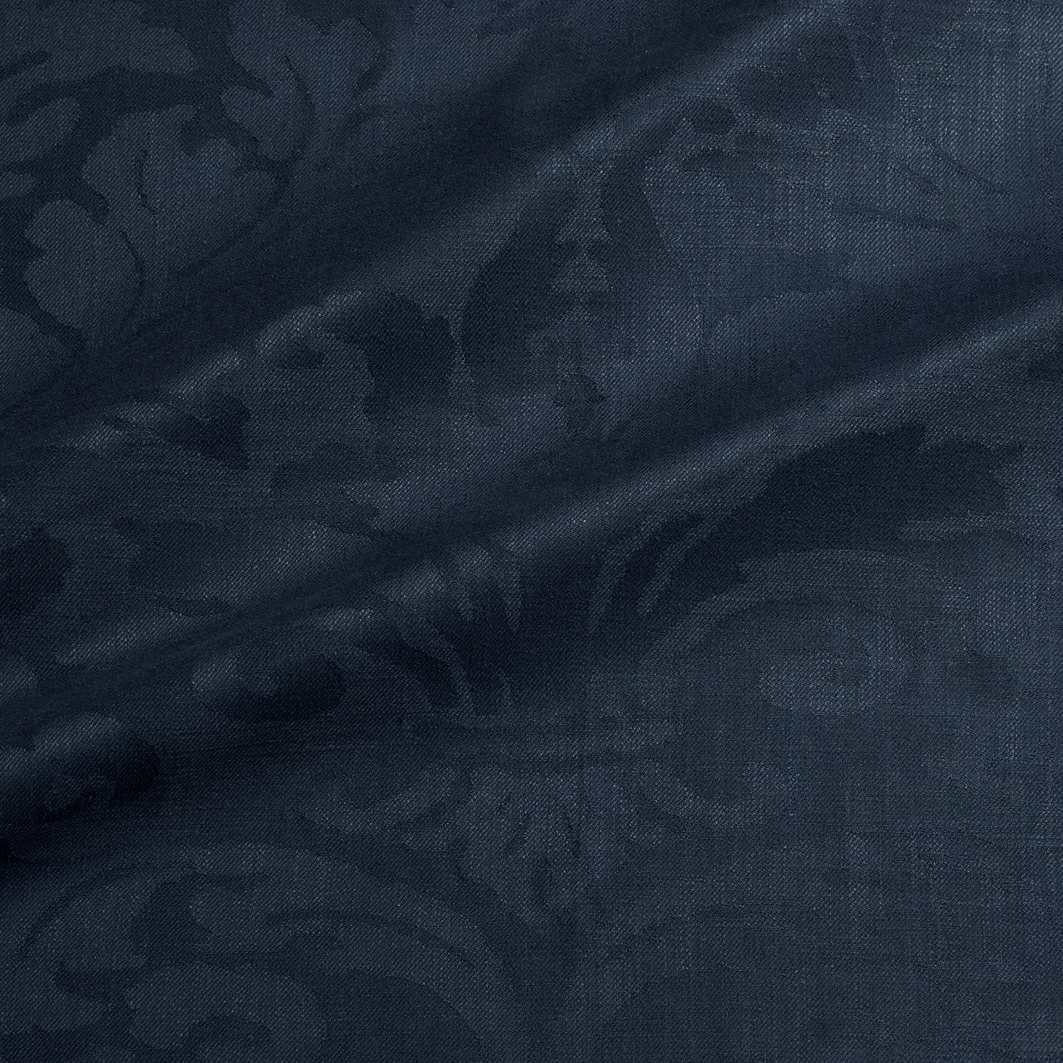 Fabric swatch of a contemporary damask fabric in a dark blue colour for upholstery and curtains.