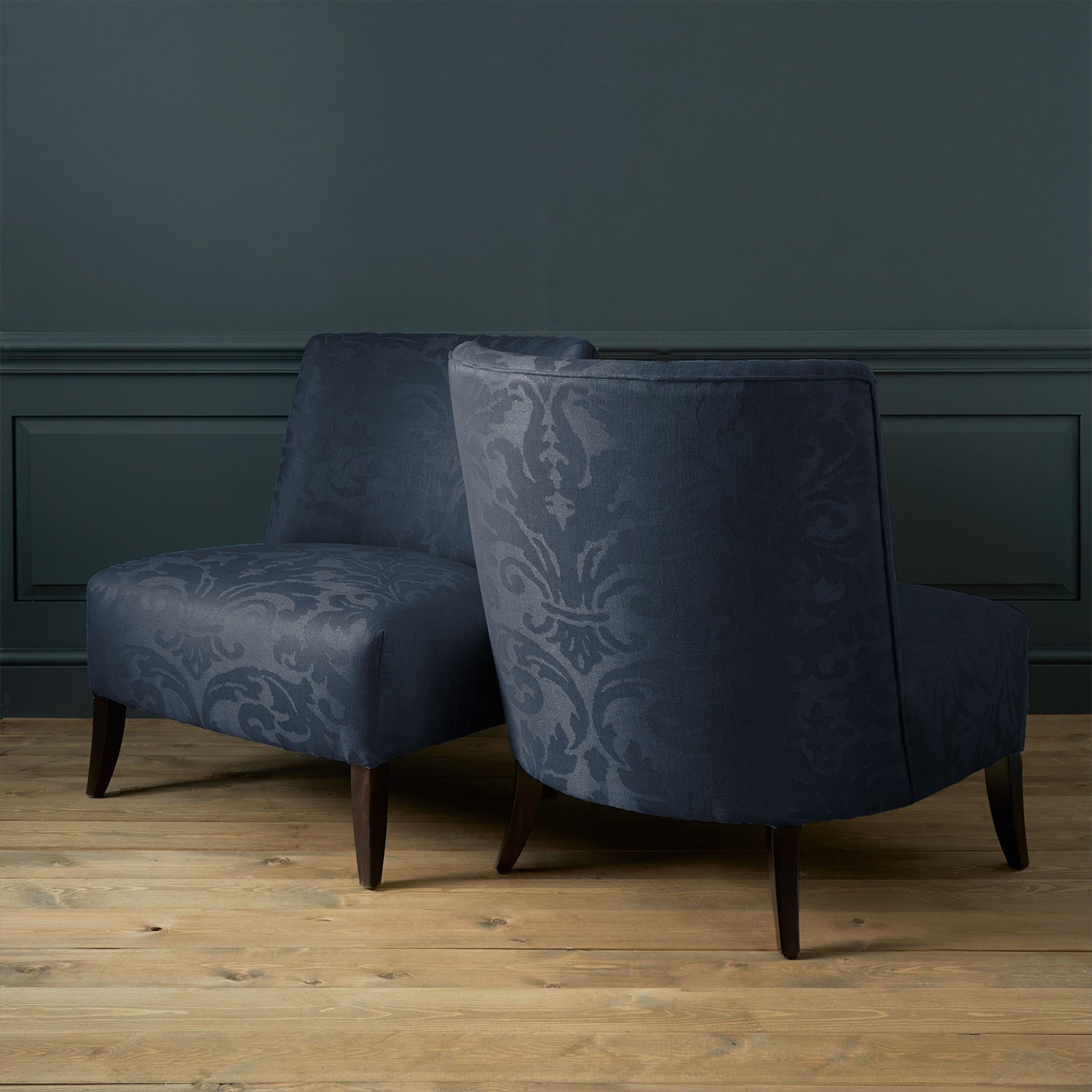Armchairs in a contemporary damask fabric with dark blue colour.