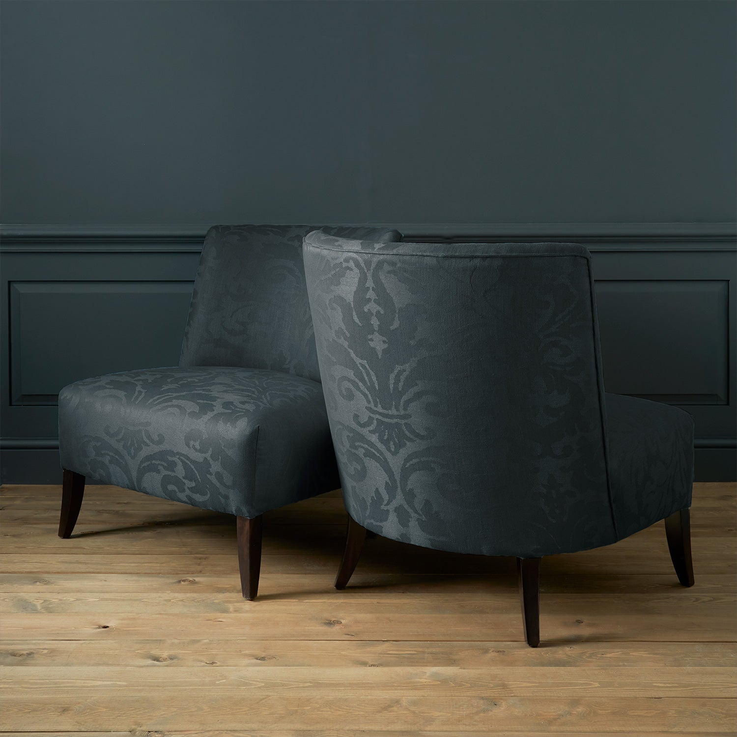 Armchairs in a contemporary damask fabric with dark grey colours.